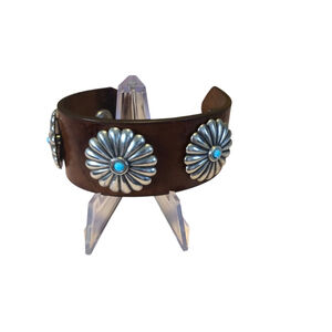 Handmade Vintage Leather Cuff With Conch and Stamped “Omega”